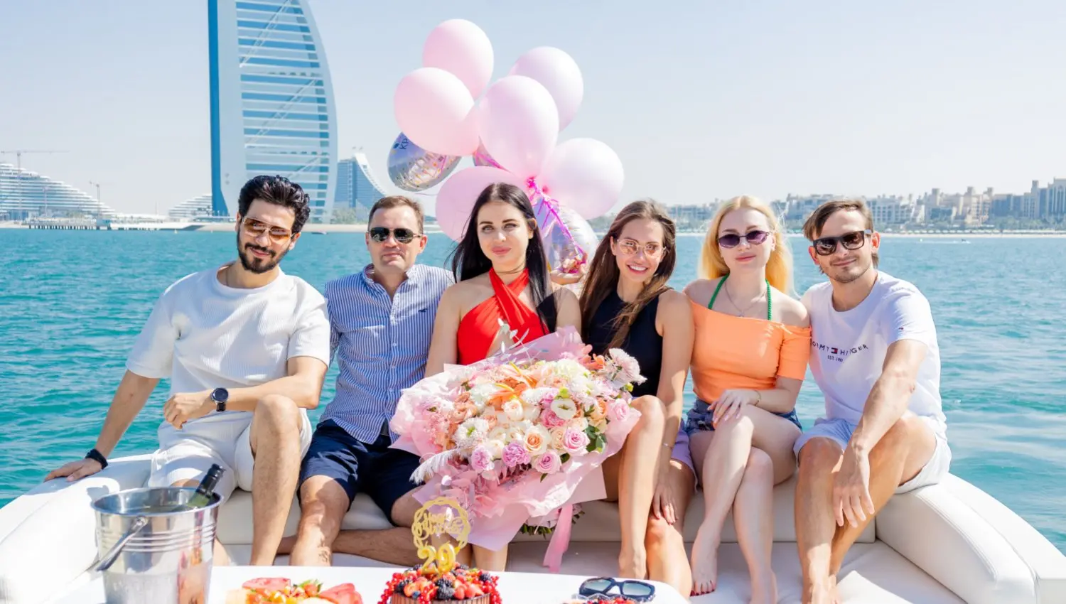  Tourists take photos with the Burj Al Arab on the yacht