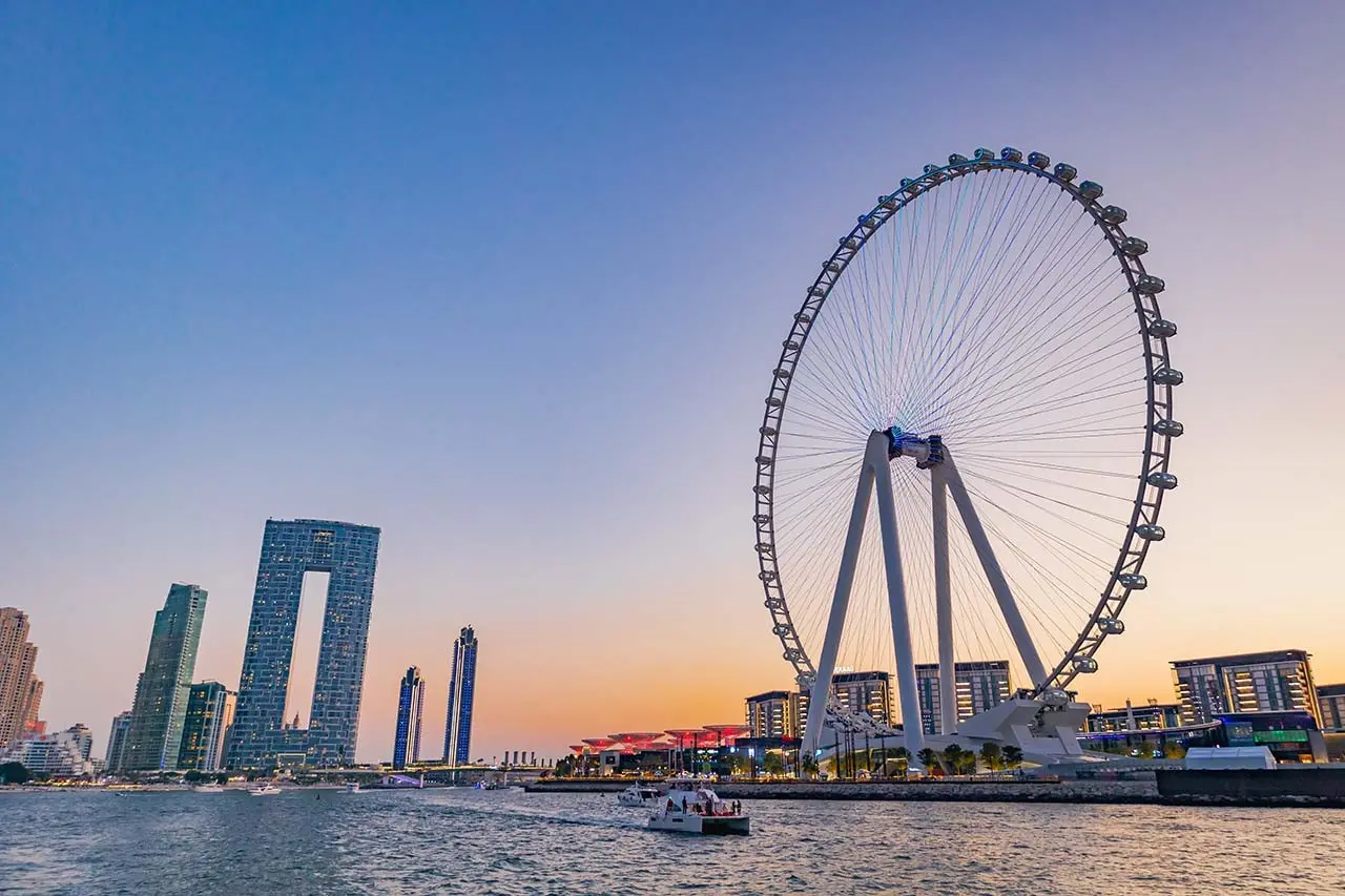 Yacht sails around Dubai waters at sunset