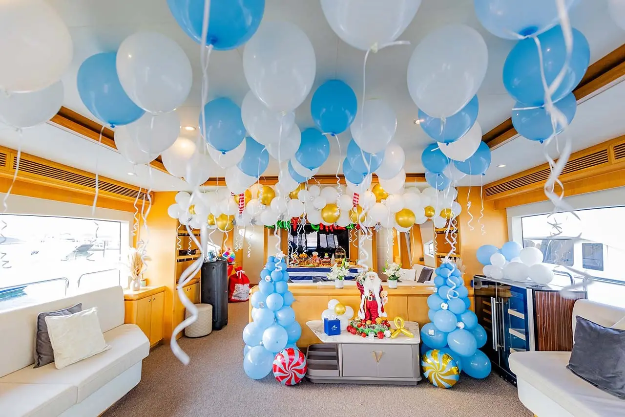 A yacht decked out in party decorations on Dubai waters