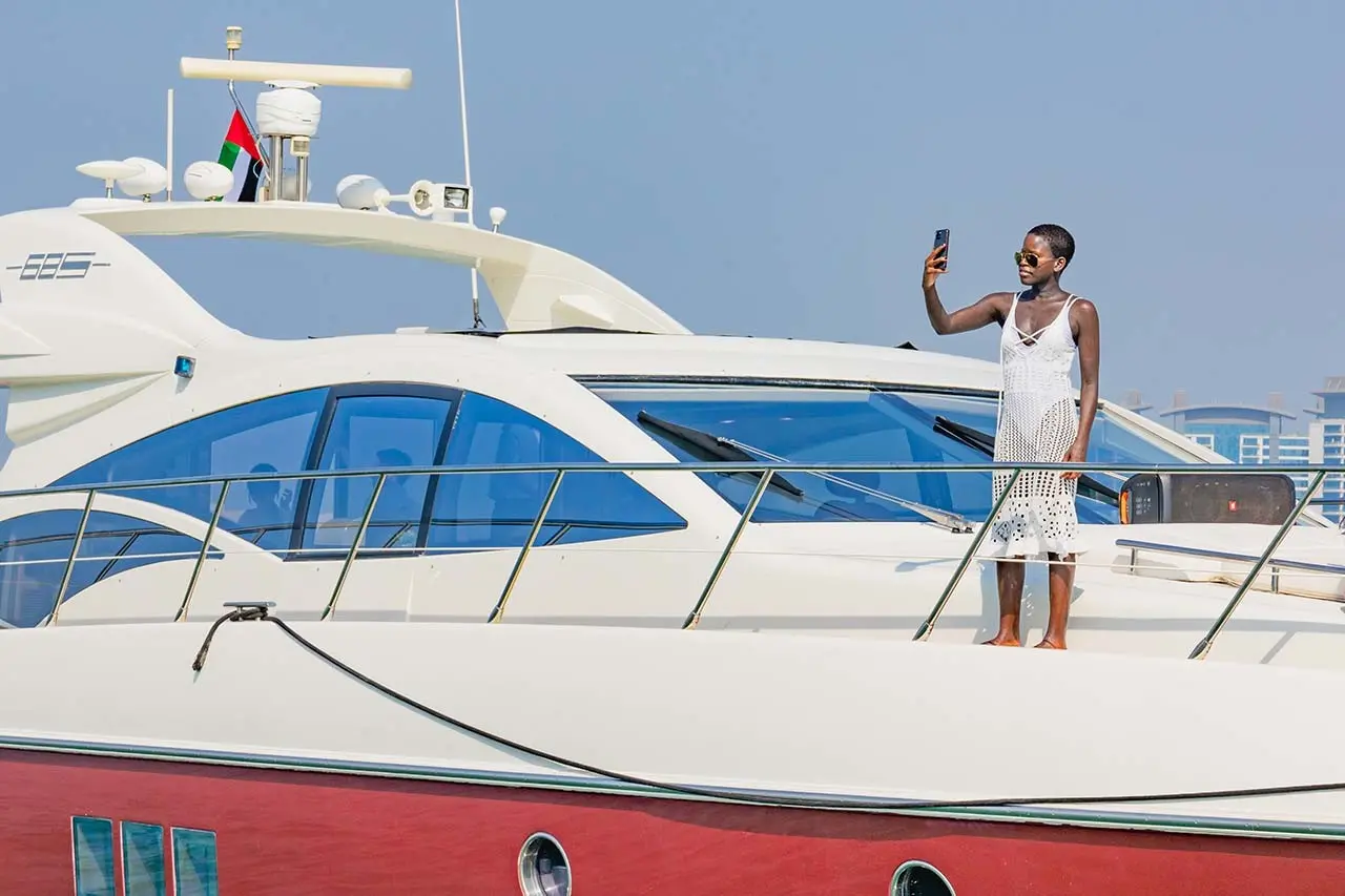 A woman sailing on a yacht in Dubai waters