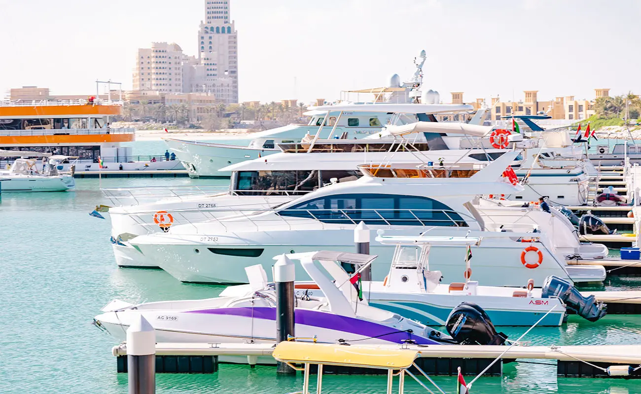 Yachts parked at the pier