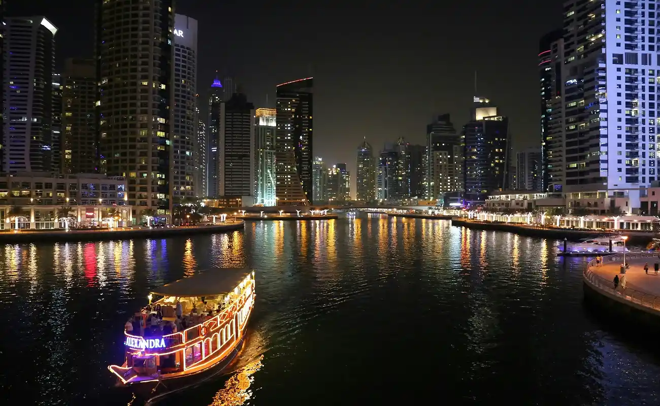 Experience a Dubai Marina dinner cruise under the stars aboard a dhow.