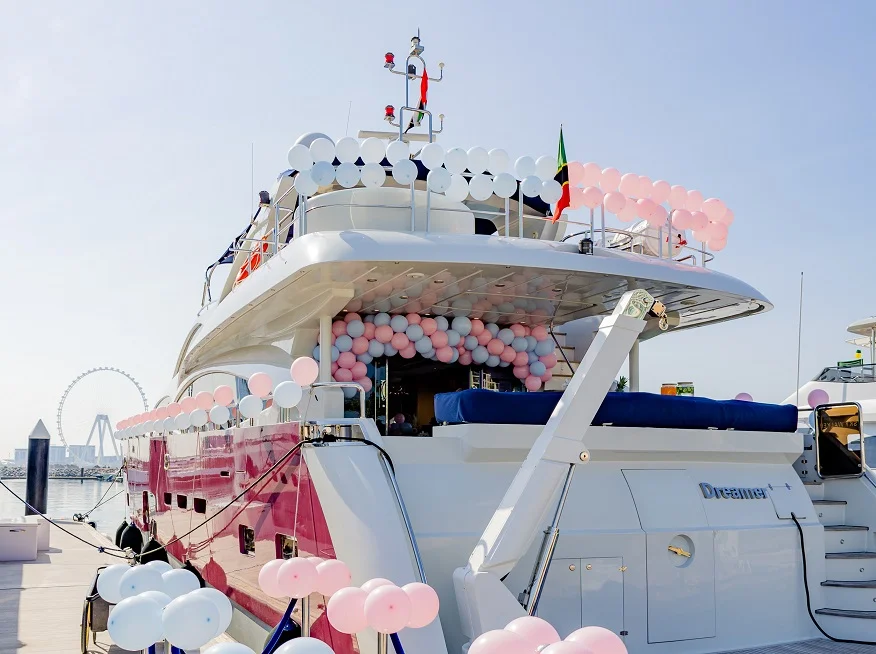 Balloon decorations on the exterior of a Dubai yacht with a romantic proposal theme.