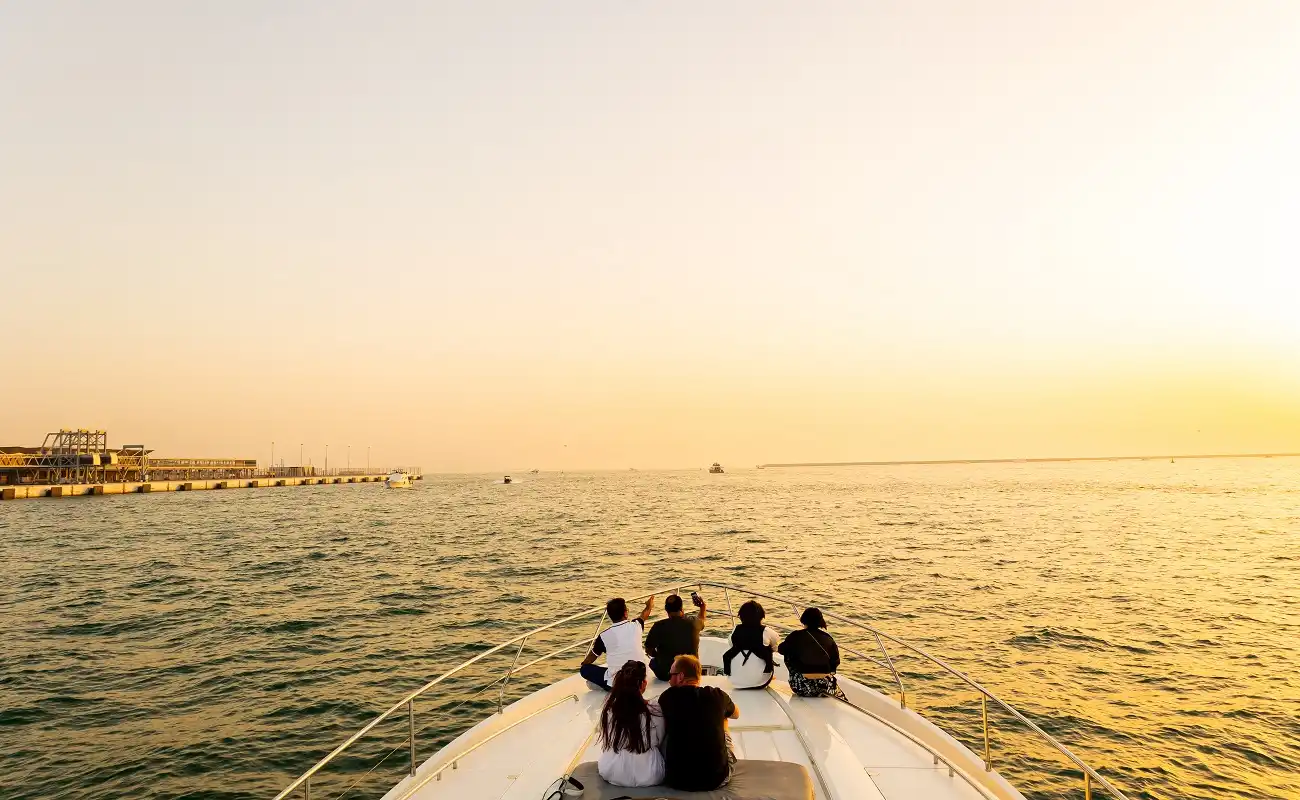Enjoy the magnificent sunset views on a yacht tour rental in Dubai.