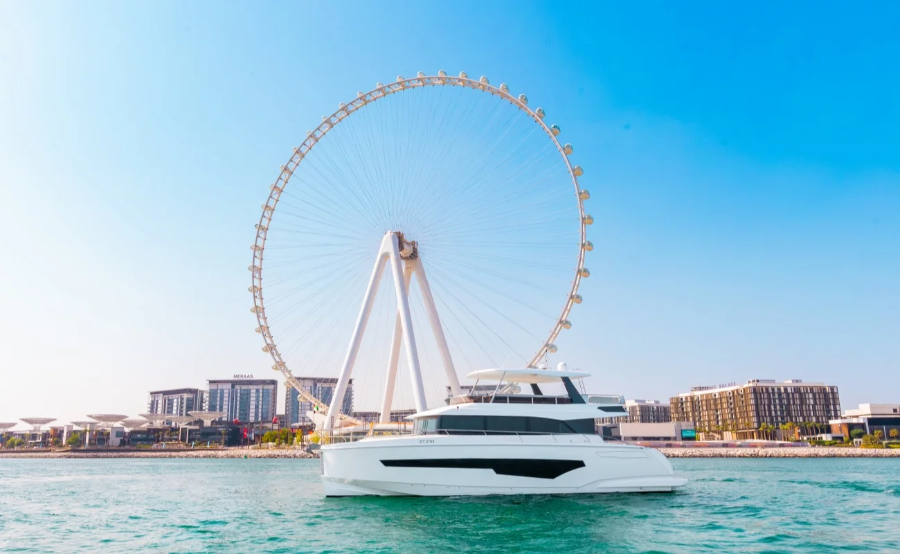 Enjoying a boat ride at Dubai Marina, with stunning views of the city skyline and the Ain wheel.