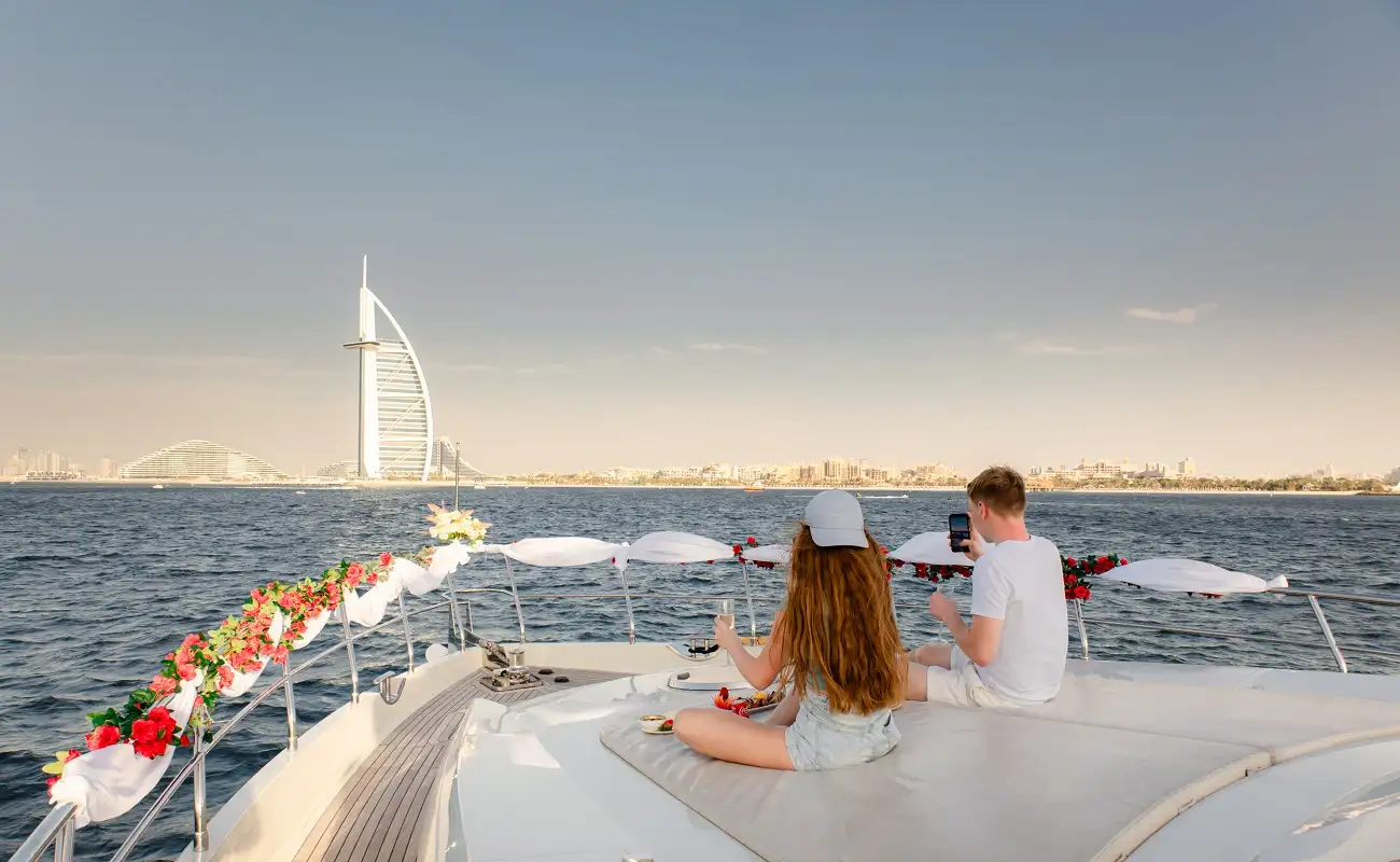 A couple enjoying a cruise in Dubai on a luxury yacht.
