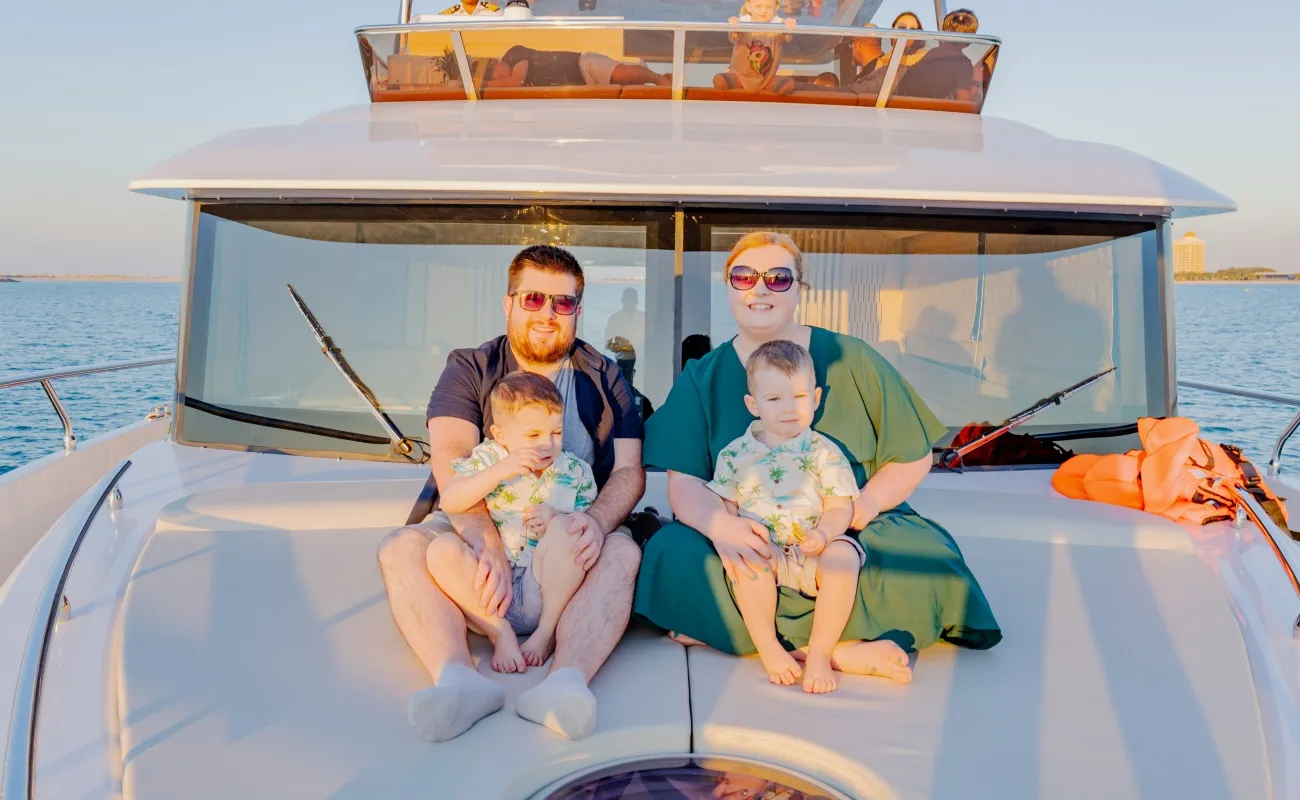 Family enjoying a serene boat trip at Marina Dubai.