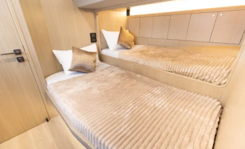 spacious bed in the yacht cabin for dubai marina night yacht tour