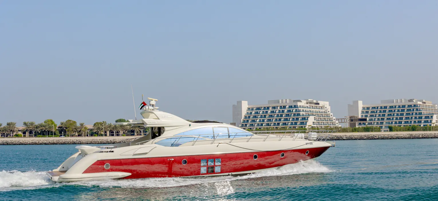 luxurious yacht docked at dubai harbour, ready for the dubai yacht ride with coastal scenery in the background