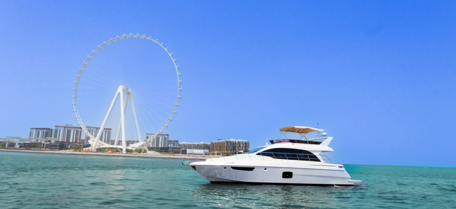 luxury yacht moored at dubai's waterfront scenery, a classic view from the sunset yacht tour with the iconic ain dubai in the background
