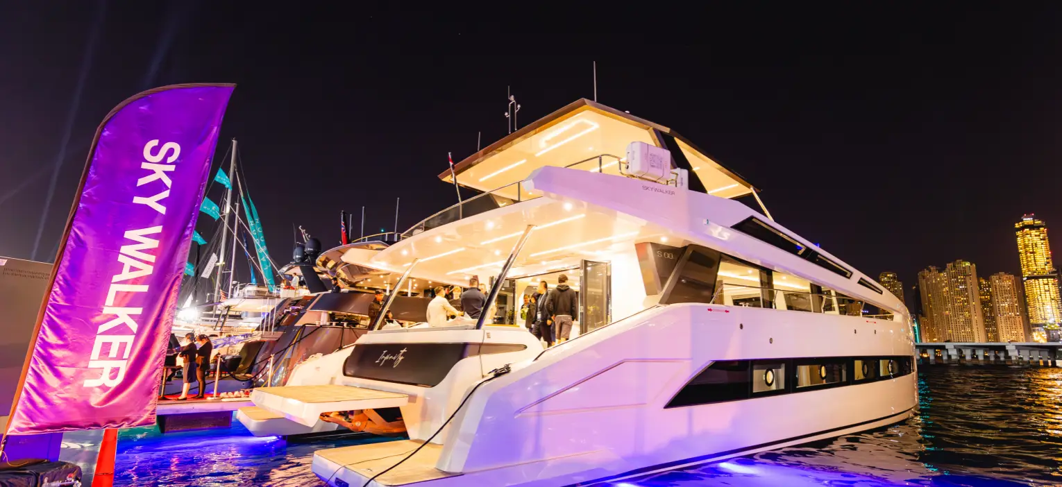 decorated exterior of the catamaran for dubai marina night yacht cruise under night lights