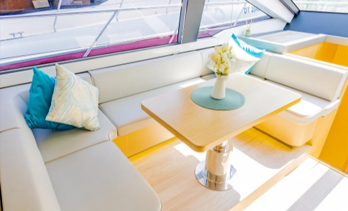 enjoy your live bbq dinner during the sunset yacht cruise, served at this neatly set onboard table.