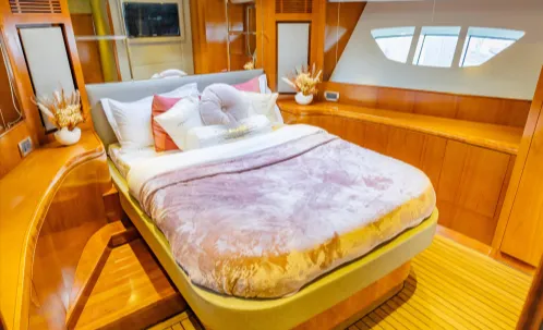 the comfortable, well-appointed bedroom onboard ensures a relaxing experience during your dubai marina yacht cruise, complementing the enjoyment of the bbq and sightseeing.