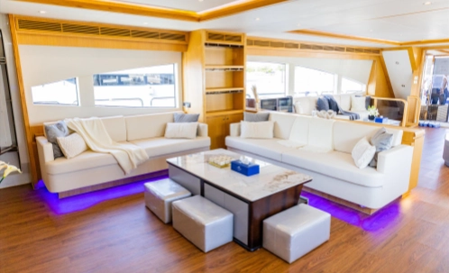 air-conditioned lounge area of premium dubai yacht, free wifi available for 2-3 hour sunset bbq tour passengers
