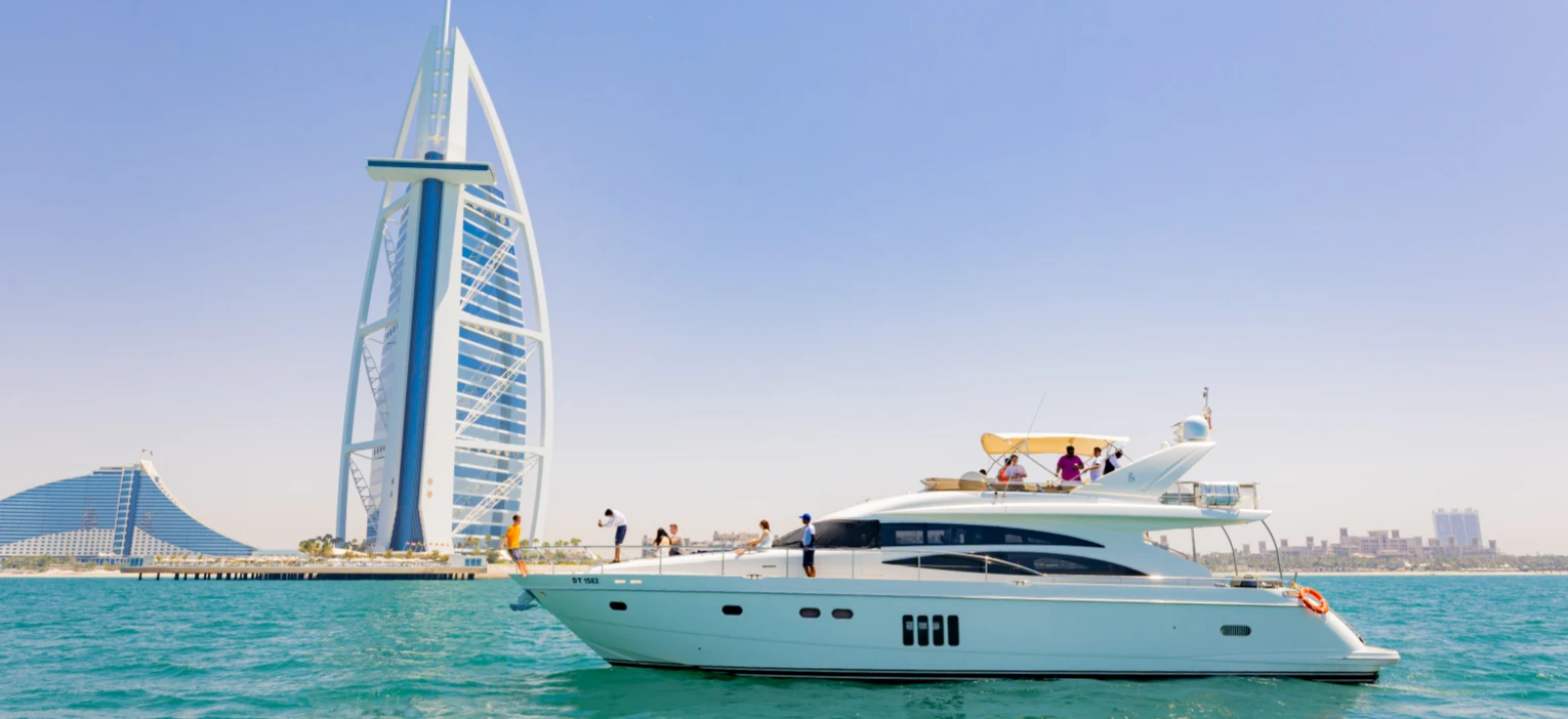 a luxury yacht sails on dubai’s waters, with the iconic burj al arab standing tall in the background, perfectly capturing the scenic dubai harbour yacht tour experience.