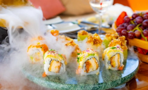 beautifully presented sushi rolls and appetizers on ice highlight the gourmet dining options available during the dubai harbour yacht tour.