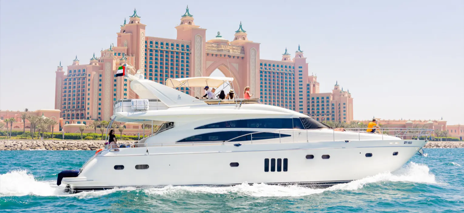 experience the dubai luxury boat cruise as a sleek white yacht glides past the iconic atlantis the palm, offering unbeatable views of dubai’s most celebrated waterfront landmarks.