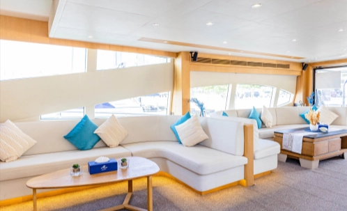 the dubai harbour yacht tour provides a comfortable indoor lounge with air conditioning, plush seating, and large windows to admire the scenic views of dubai marina and jbr.
